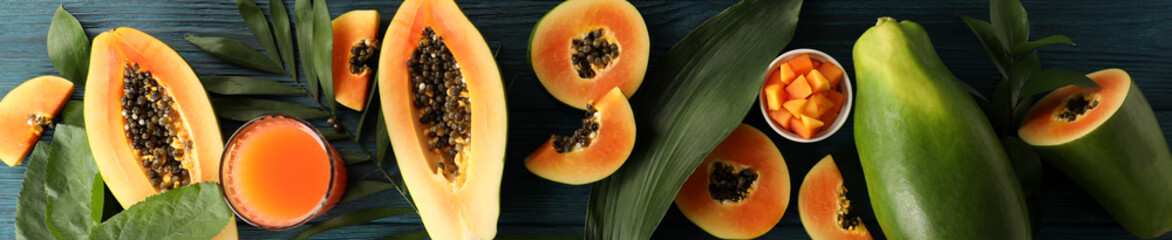 Fresh ripe papaya on wooden background, top view - obrazy, fototapety, plakaty