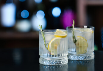 Glasses of cold gin tonic on table in bar