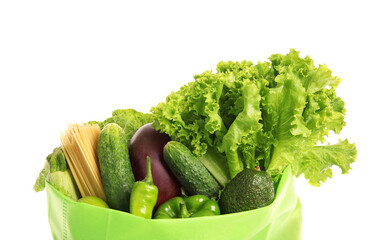 Eco bag with different products on white background, closeup