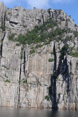 White and grey extremely steep granite rock walls of Lysefjord fjord and canyon in Norway in Scandinavia