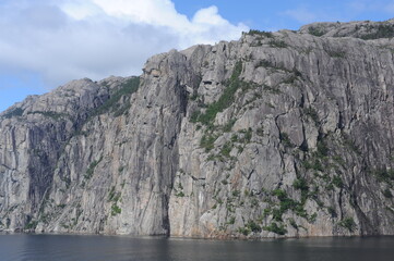 Fototapeta na wymiar White and grey extremely steep granite rock walls of Lysefjord fjord and canyon in Norway in Scandinavia