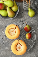 Grid with tasty pear pot pies and fresh fruits on grunge background