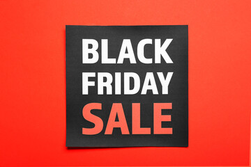 Card with text BLACK FRIDAY SALE on color background