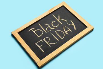 Chalkboard with text BLACK FRIDAY on color background
