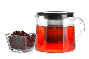 Teapot of tasty tea with cranberry on white background