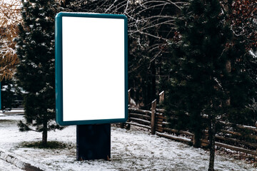 Blank billboard mockup for advertising, at the winter road at the mountains. Blank billboard ready...