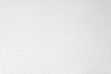 Abstract background from a piece of foam. Background: expanded polystyrene sheet