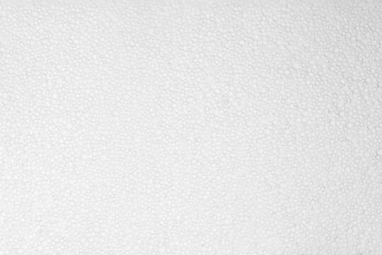 Abstract background from a piece of foam. Background: expanded polystyrene sheet