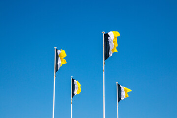 Flags of Arcachon waving in the air on a summer day in France