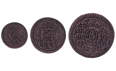 Chocolate chip cookies of different sizes isolated on white background.