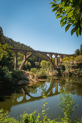 Fototapeta na wymiar Old railway bridge in Poço de Santiago in Sever do Vouga, Aveiro, Portugal