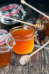 a spoon for honey together with high-quality bee honey