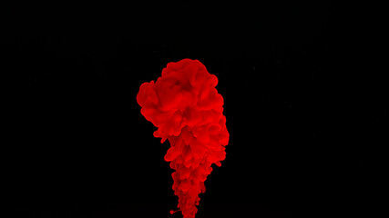 Red watercolor ink in water on a black background. Waves and drops of red paints. Cosmic magic background. Blood-red cloud of ink.