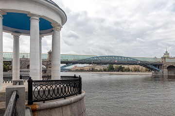 Gazebo-rotunda in Gorky Park and pedestrian Andreevsky Bridge