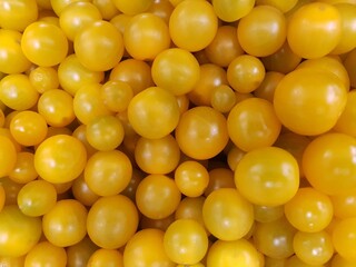 yellow cherry tomatoes. Background and texture