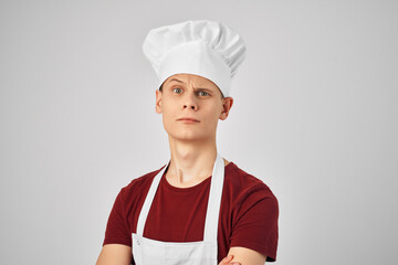 chef in an apron with a cap on his head self-confidence restaurant profession