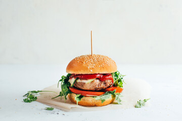 close-up of a burger on a white background