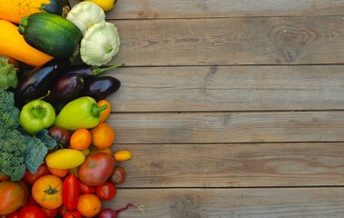 Many different colorful vegetables on a wooden background . Harvest and summer season concept. copy space