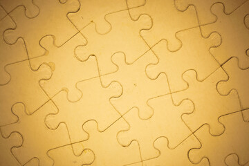 Fototapeta premium Brown Jigsaw puzzle background.