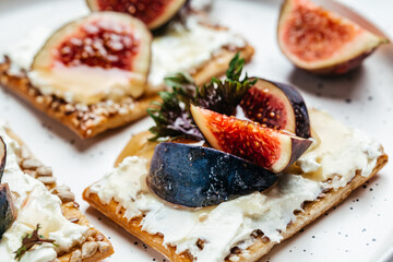 Fresh figs toast with philadelphia cheese. Clean eating, dieting or recipe of healthy snack. Detox and healthy superfoods