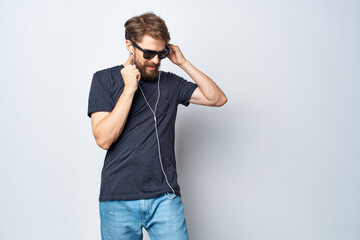 Cheerful man headphones sunglasses music dance fun studio lifestyle