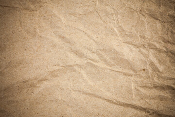 Textured crumpled packaging brown paper background.