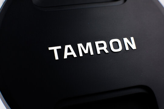 LVIV, UKRAINE - March 20, 2021 : Tamron camera lens. Brand label. close up.