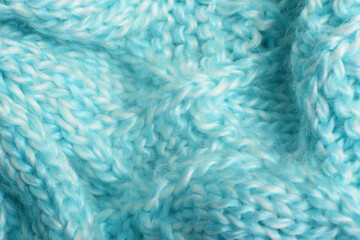 Close up of blue knitted textured background.