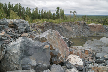 Basalt. Fancy patterns on the rocks. The texture of the stone. Severoonezhsky basalt mine....