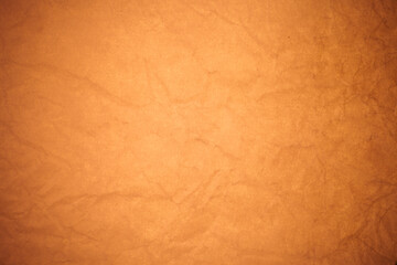 Crumpled brown paper background.