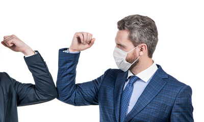 Man lawyer in face mask touch elbows with colleague using coronavirus greeting, elbow bump