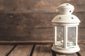 old lantern on a wooden background