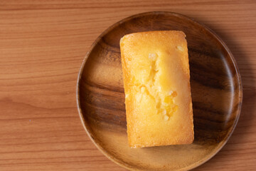 Orange cake with fresh milk on wooden floor