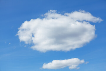 Naklejka na ściany i meble Typical white cloud on the blue sky . Summer day heaven 