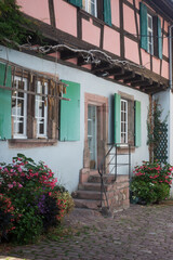 View of medieval house facade in the famous village of Riquewihr in France