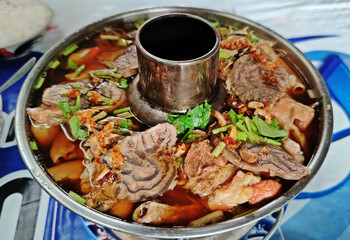 Braised beef (Stewed Beef) with offal and meat ball soup in hot pot.