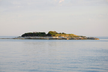 Mediterranean island in Adriatic sea, Istria, Croatia. Idyllic view of island in sea against cloudy sky