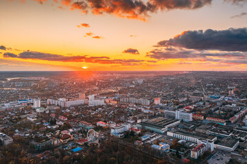Fototapeta na wymiar Gomel, Belarus. Aerial View Of Homiel Cityscape Skyline In Autumn Evening. Residential District And River During Sunset. Bird's-eye View