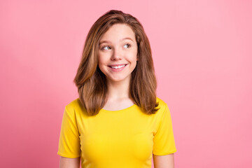 Obraz premium Photo of young cheerful girl happy positive smile think curious look empty space isolated over pink color background