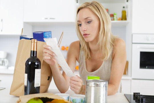 a woman is checking shopping list
