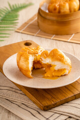 Fried Salted Egg Baozi or Bakpao is a type of yeast-leavened filled bun in various Chinese cuisines.