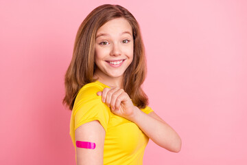 Profile photo of funny brown hair teen girl show plaster wear yellow t-shirt isolated on pink color...