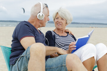 affectionate senior couple on tropical beach holiday