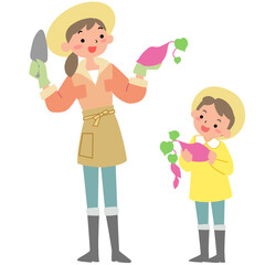 芋掘りをする親子