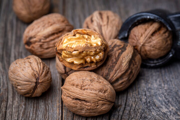 Walnuts on the wooden background