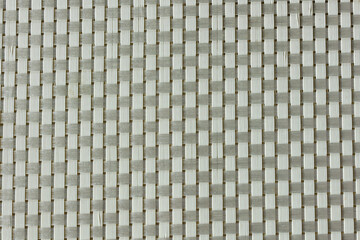 Fototapeta premium simple woven texture braided mat may used as background. woven strips brown background. 