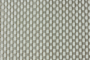 simple woven texture braided mat may used as background. woven strips brown background.  