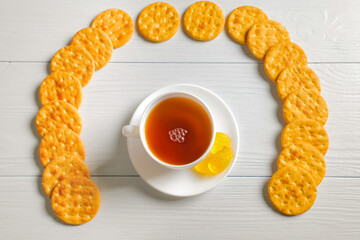High resolution photo: Flatlay tea cup with crackers and some marmelade