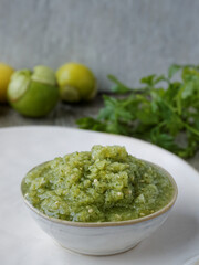 Fresh tomatillo green salsa (salsa verde cruda) in a bowl. Typical Mexican cuisine.