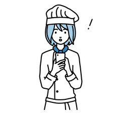 立ってスマートフォンを操作して何かに気づいて驚いた調理師の女性